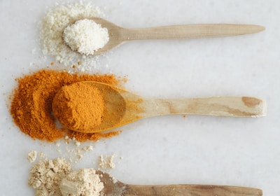 Three spoons with different types of spices on them